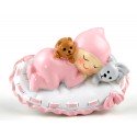 Imán bebé sobre almohada en rosa